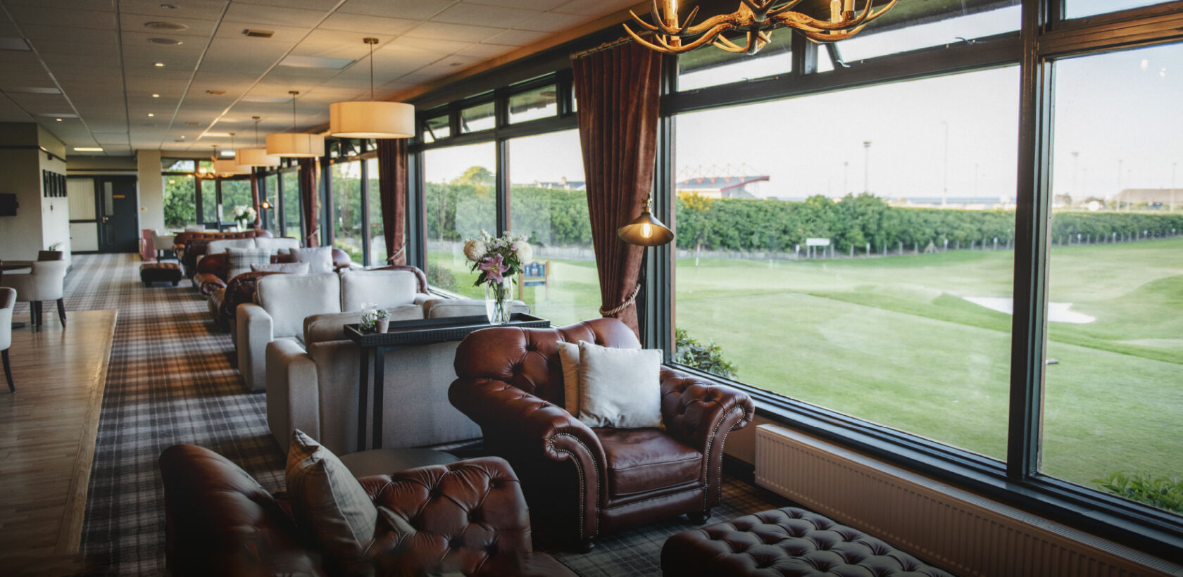 View from the inside of the Clubhouse at Duff House Golf Club looking over the green