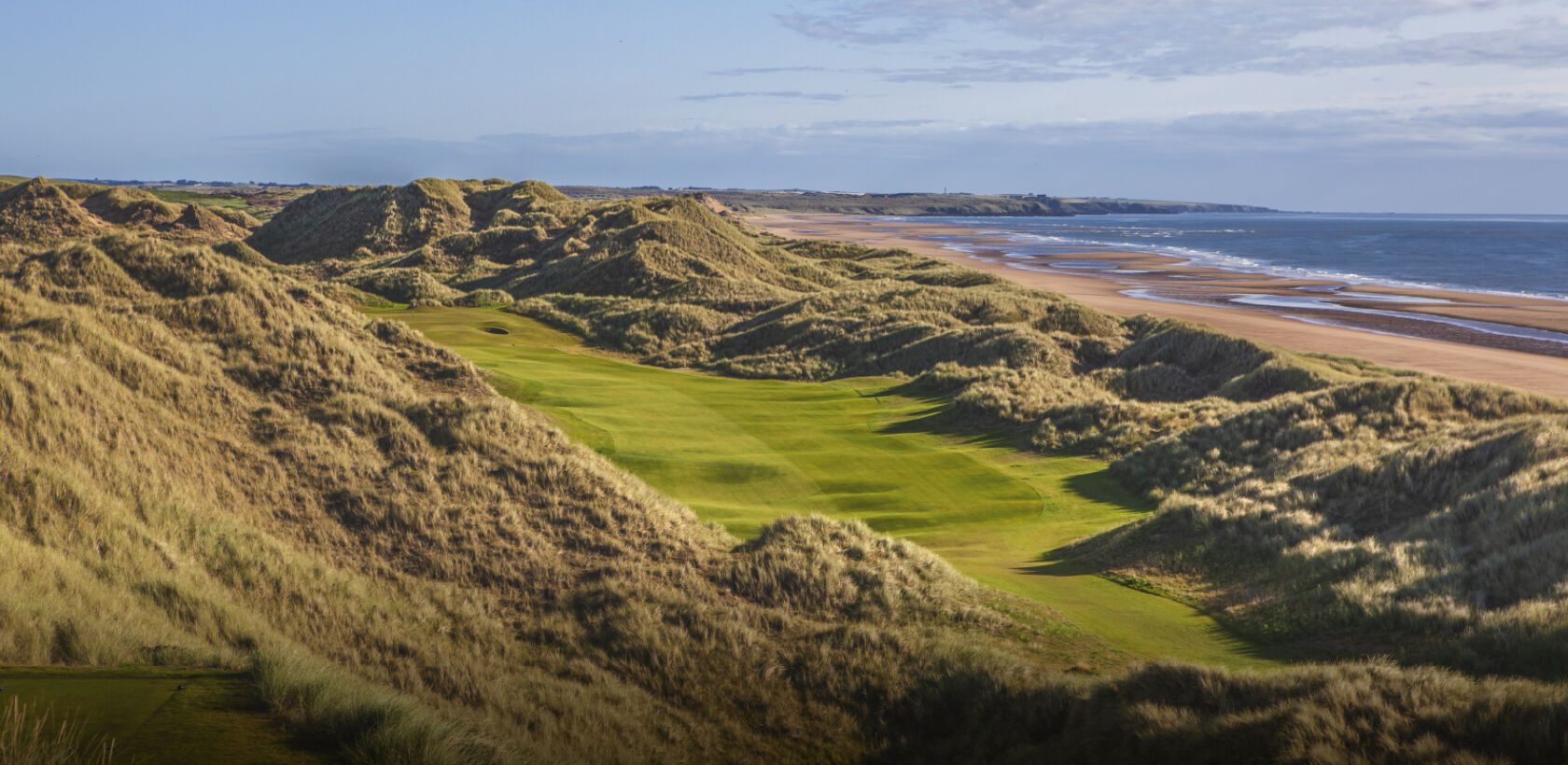 Ariel view of the Trump Golf Course next to the beach and North Sea